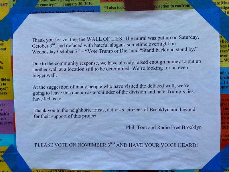 A sign at the Wall of Lies in Bushwick, an installation with 20,000 lies told by President Trump