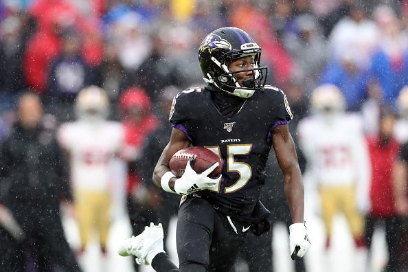 Marquise Brown of the Ravens runs after making a catch.