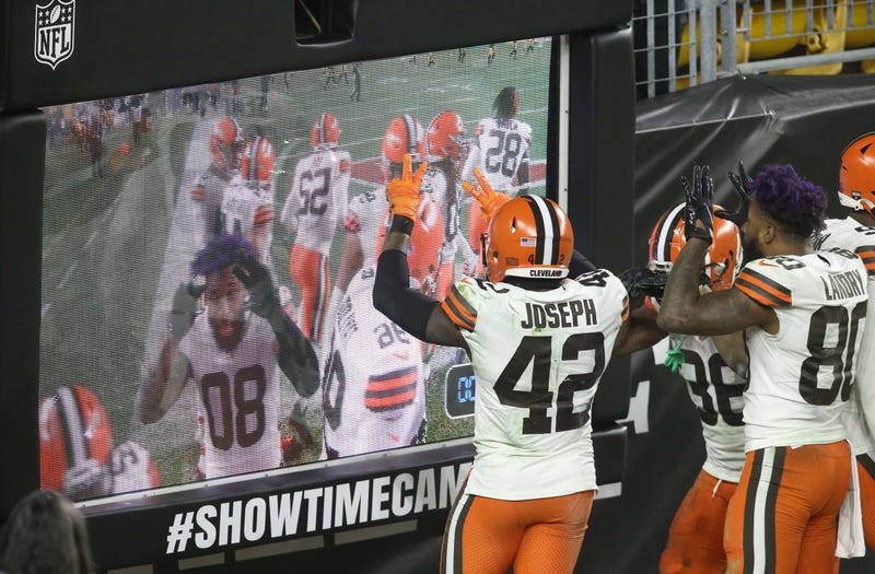 Cleveland Browns players including strong safety Karl Joseph and wide receiver Jarvis Landry celebrate at the showtime camera against the Pittsburgh Steelers.