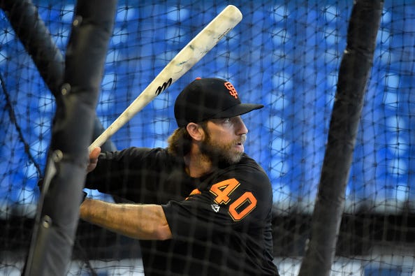 Madison Bumgarner takes batting practice with the Giants.