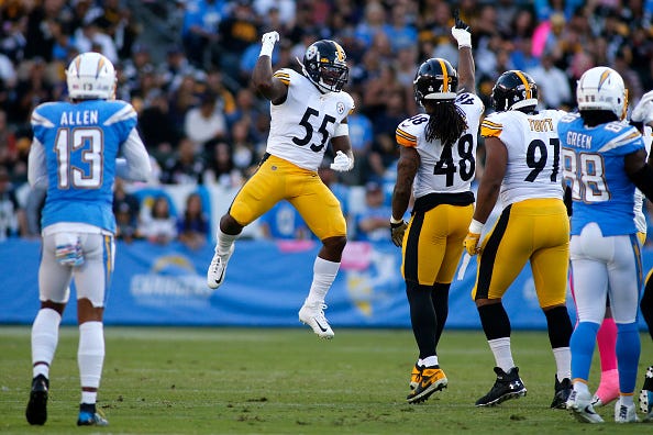 Devin Bush gets some air after a big play with the Steelers.