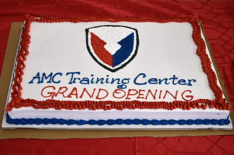 The photo displays a cake, designed for the Army Material Command (AMC) Training Center grand opening at Rose Barracks, Vilseck, Germany, Sept. 5, 2019.