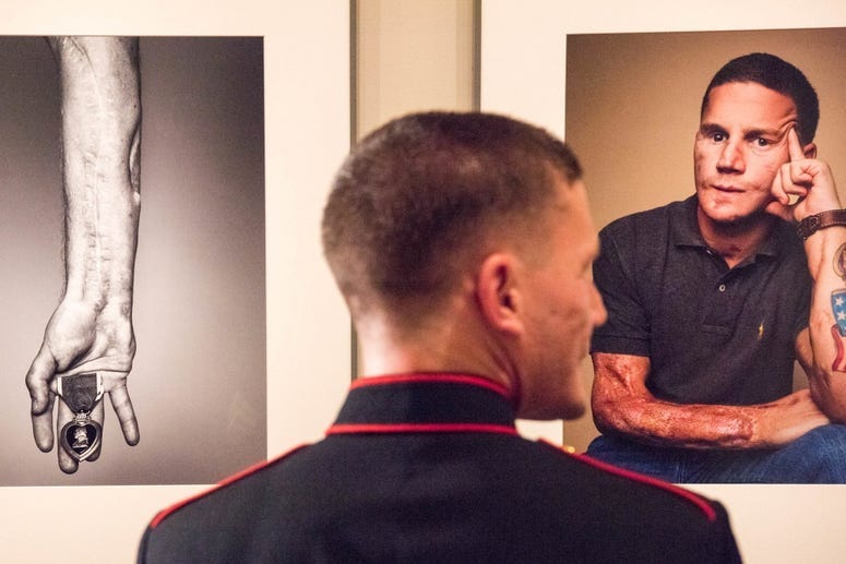 U.S. Marine Cpl. Kyle Carpenter observes his portrait at the National Portrait Gallery in Washington, D.C., Nov. 15, 2015. Carpenter is the youngest living Medal of Honor recipient.