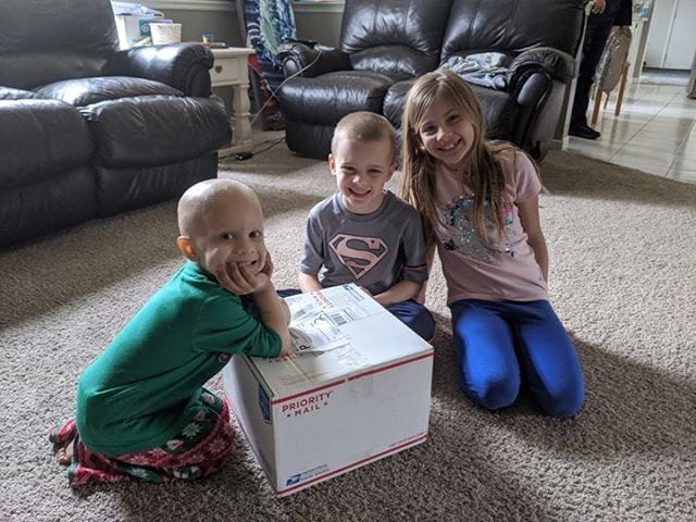 A Casey Cares Family With Their Care Package