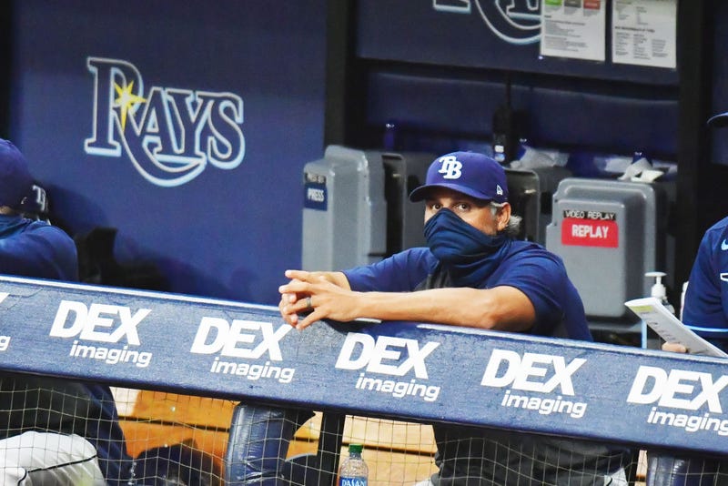 Kevin Cash looks on from the Rays dugout.