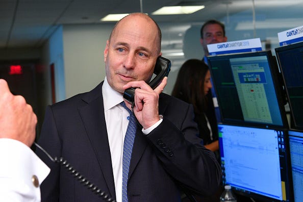 Yankees GM Brian Cashman visits Cantor Fitzgerald at its 9/11 charity day.