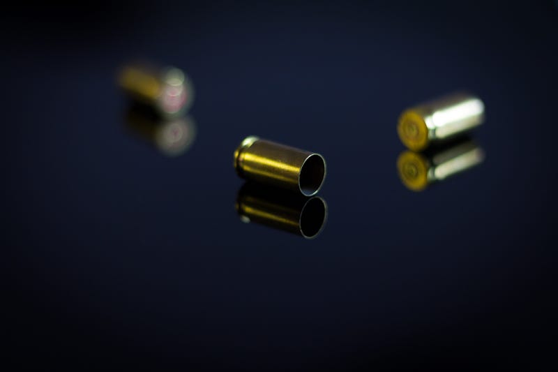 Casings of bullets on a glass table
