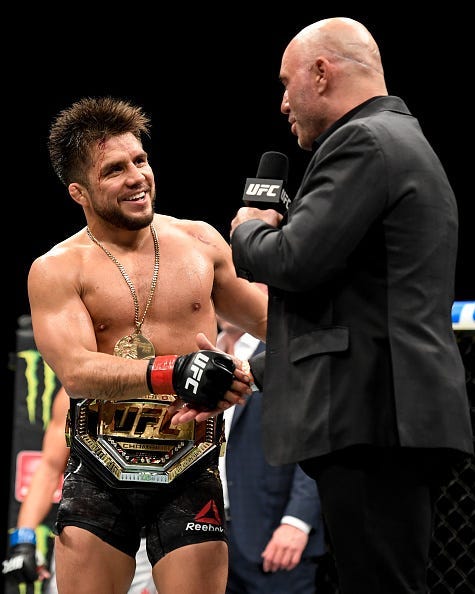 Cejudo and Rogan shake hands.