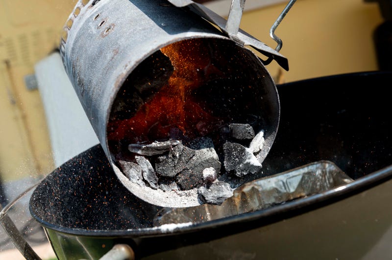 A charcoal chimney starter
