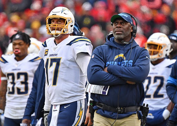 Philip Rivers and Anthony Lynn watch from the Chargers' sidelines.