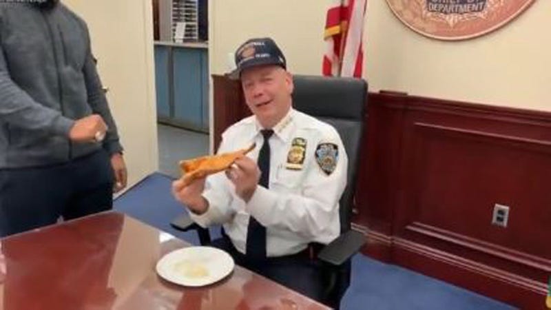 Chief Monahan eats a New York slice
