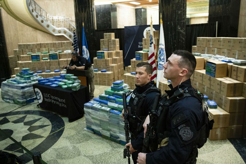 Officers stand guard over a fraction of the cocaine sized from a ship at a Philadelphia port is seen ahead of a news conference at the U.S. Custom House in Philadelphia, Friday, June 21, 2019.