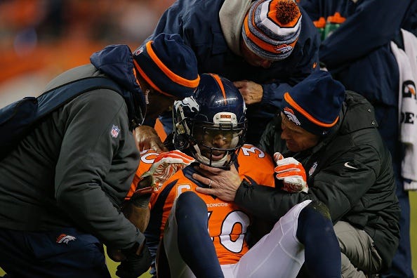 Broncos safety David Bruton is evaluated for a concussion.