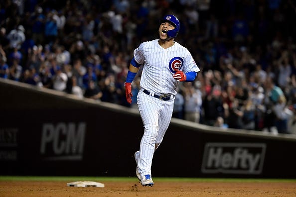 Willson Contreras celebrates hitting a home run.