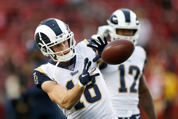 Cooper Kupp catches a pass while warming up for the Rams.