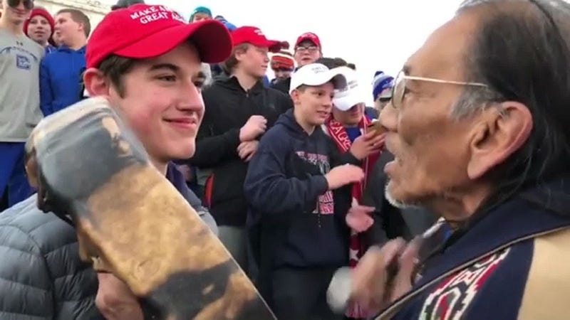 Teens and Native American elder