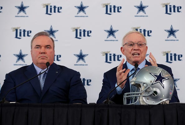 Cowboys head coach Mike McCarthy and owner Jerry Jones speak at a press conference.