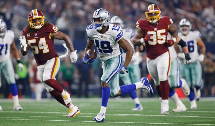 Cowboys wide receiver Amari Cooper (19) runs for a touchdown after catching a pass in the third quarter against the Washington Redskins at AT&T Stadium in Arlington, Texas.