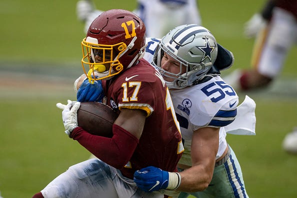 Leighton Vander Esch tackles Terry McLaurin in a Cowboys-Washington game.