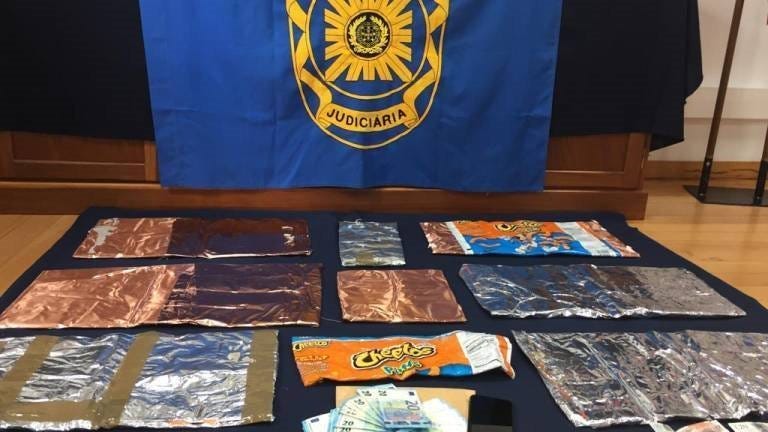 Passengers are accused of smuggling cocaine inside bags of Cheetos.