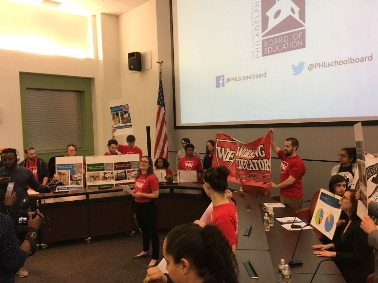 Activists opposed to the policy then disrupted Friday night's meeting as a divided school board has approved a policy requiring all district high schools to use walk-through metal detectors.