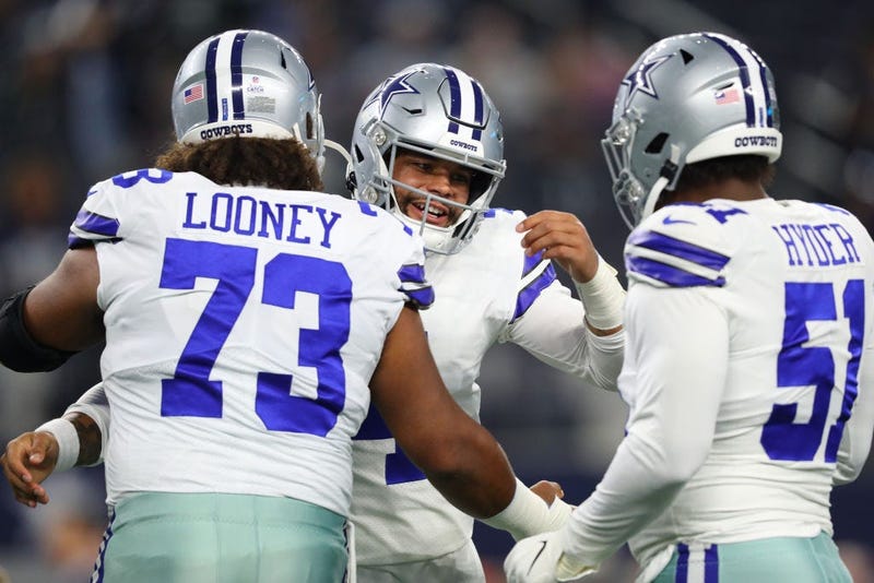 Dak Prescott and Joe Looney hug before Dallas Cowboys game