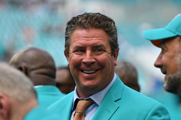 Dan Marino chats on the sidelines prior to a Dolphins game in 2019.