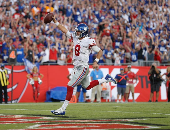 Giants QB Daniel Jones celebrates a rushing TD.