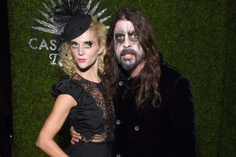 Dave Grohl and his wife Jordyn Blum attend a Halloween party in costumes.