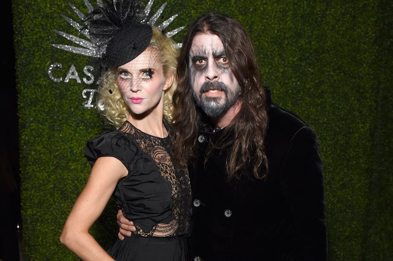 Dave Grohl and his wife Jordyn Blum attend a Halloween party in costumes.