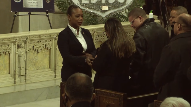 NYPD Commissioner Keechant Sewell hands a detective shield to Officer Jason Rivera's widow, Dominique Luzuriaga