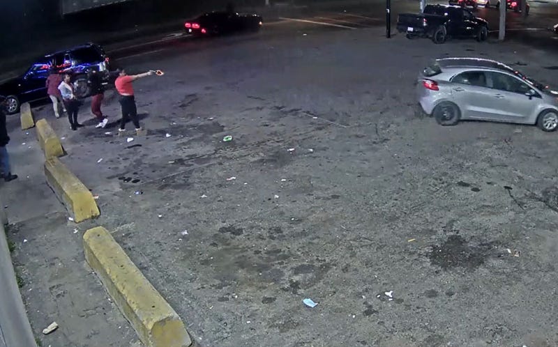 female suspect opens fire at a car