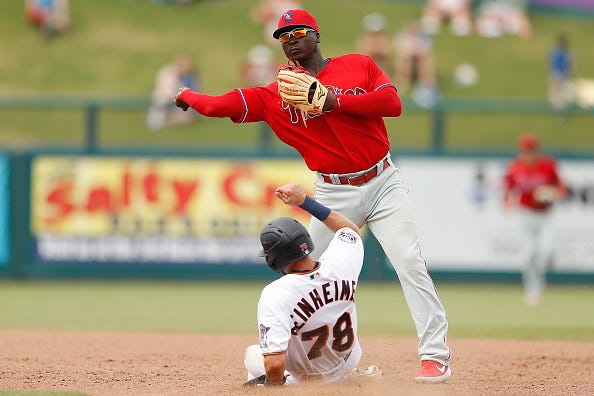 Didi Gregorius turns a double play in spring training.
