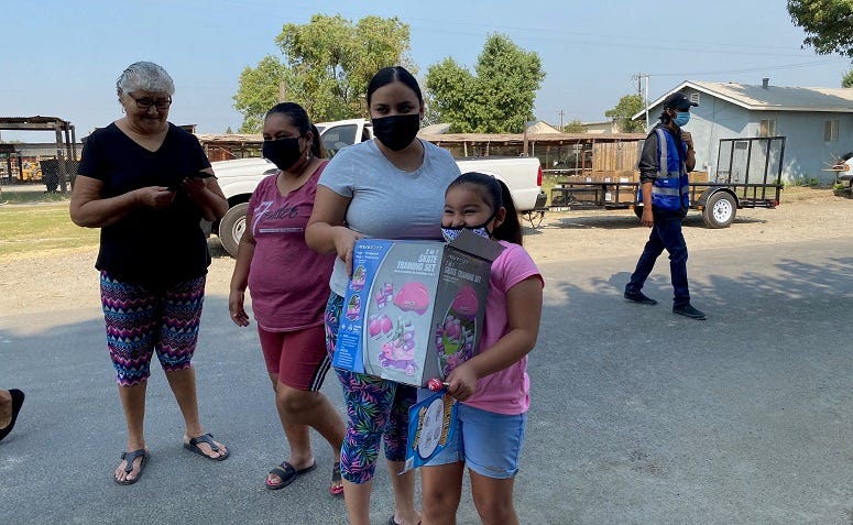 A Central Valley family picks up necessary supplies and other donations during the coronavirus pandemic