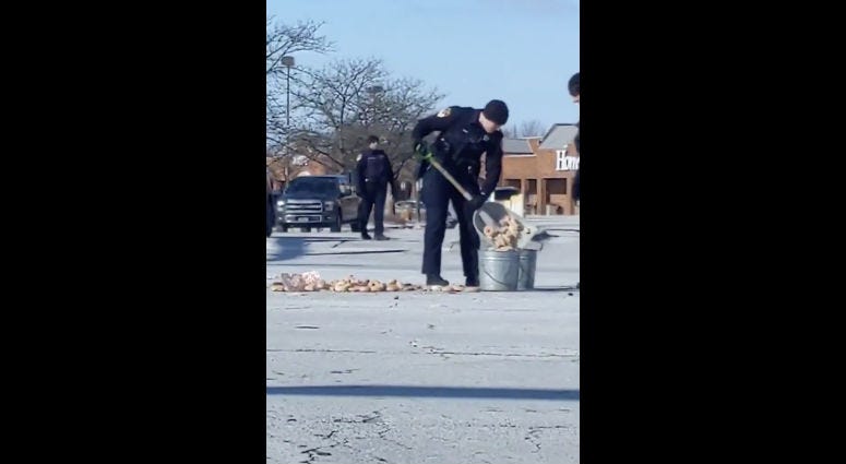 Wheaton Police clean up dozens of spilled donuts in the road