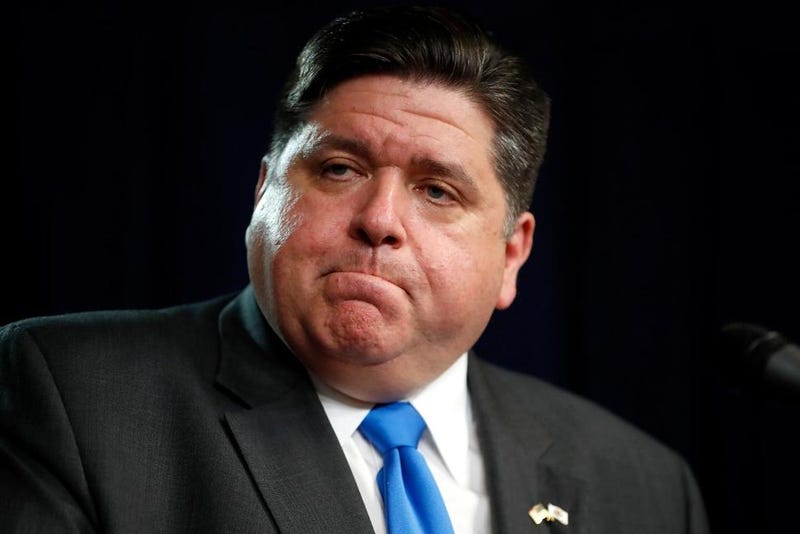 Illinois Gov. J.B. Pritzker listens to a question after announcing a shelter in place order to combat the spread of the Covid-19 virus, during a news conference Friday, March 20, 2020, in Chicago.