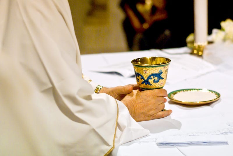 Priest at Church