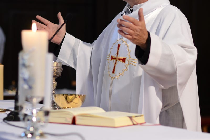 Priest and worship at the altar.