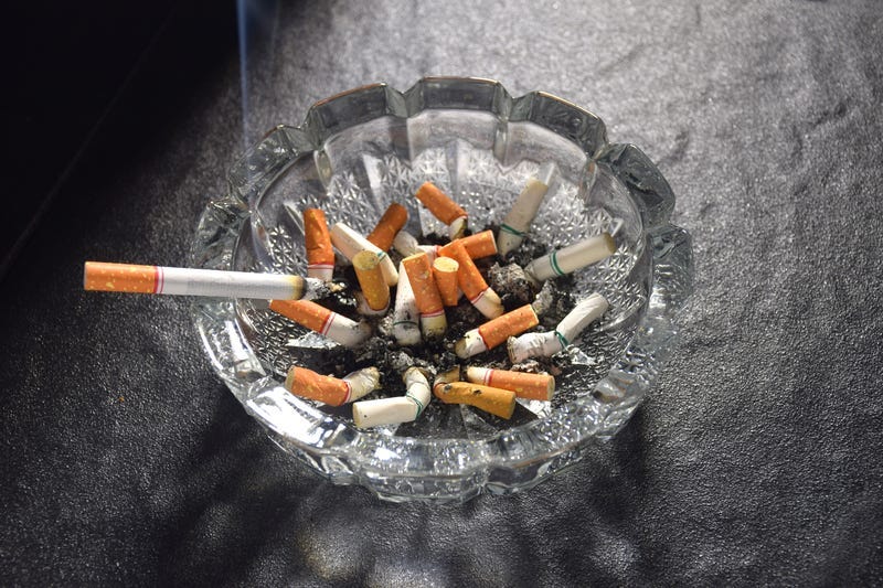 Cigarettes in an ash tray.