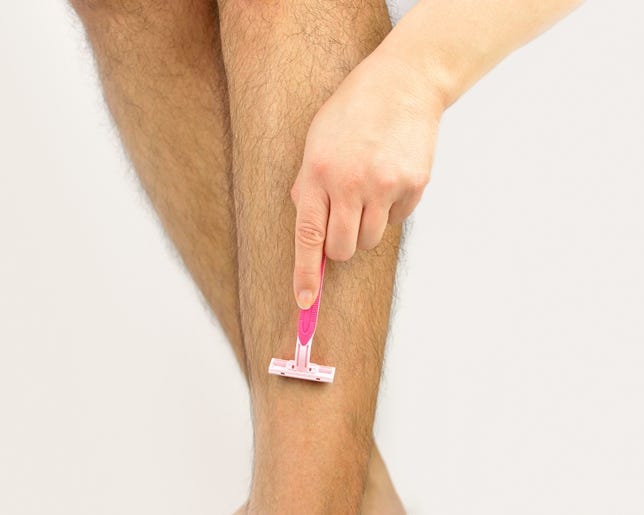 Shaggy woman shaving