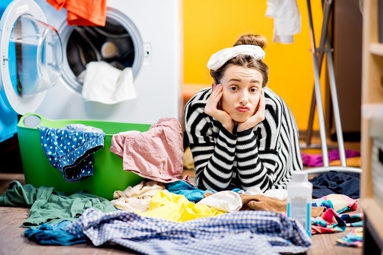 Woman washing clothes at home.