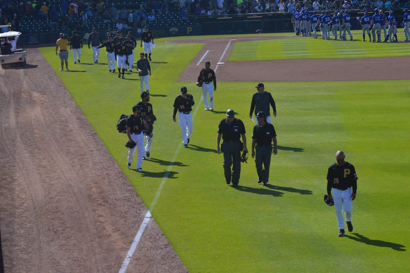 Pirates walk off field