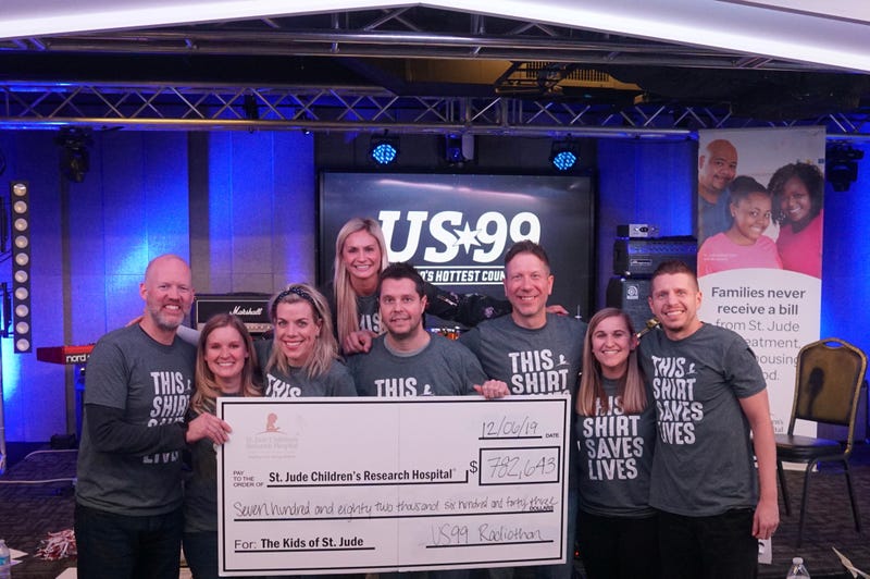 US99 staff with check for St. Jude