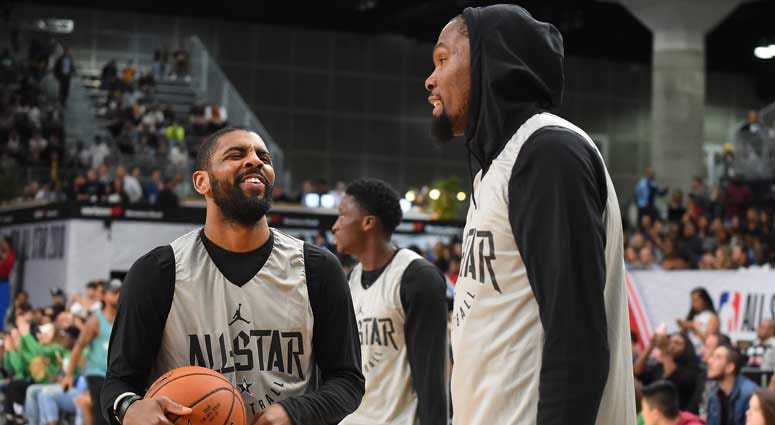Kevin Durant and Kyrie Irving talk at the 2018 NBA All-Star Game.