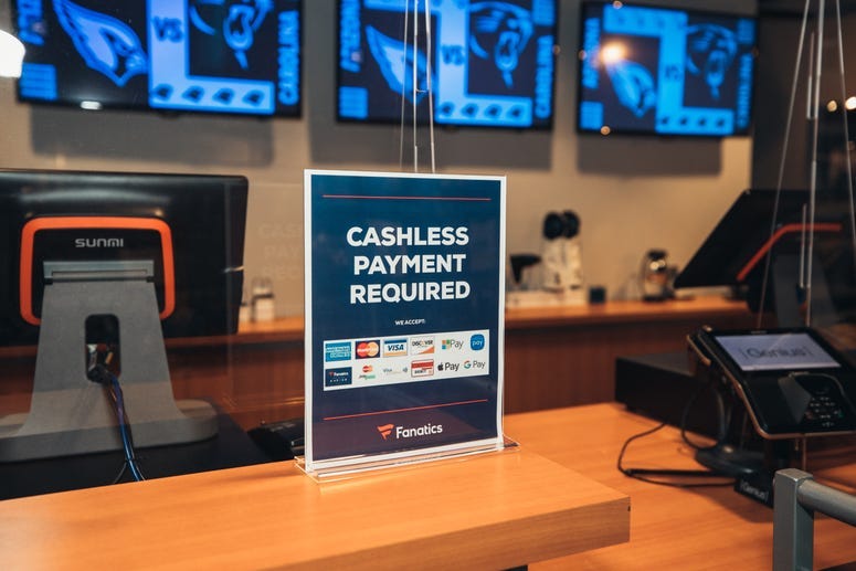 Signs letting fans know that pay will be cashless