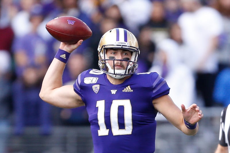 Jacob Eason looks to make a pass against USC.