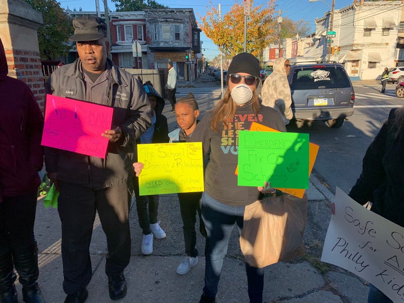 Protesters demand district abate asbestos at school