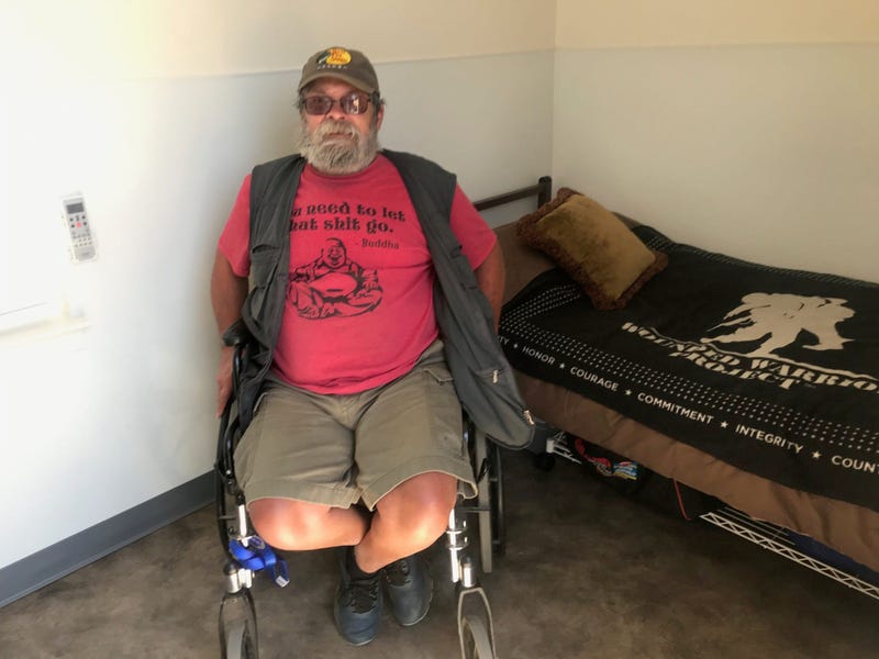 A homeless resident in his new, socially distanced shelter