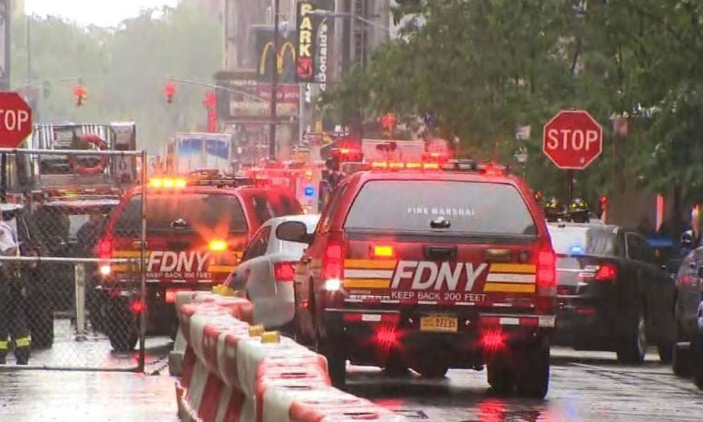 The FDNY responds to a helicopter crash on the roof of a Midtown building in New York City.