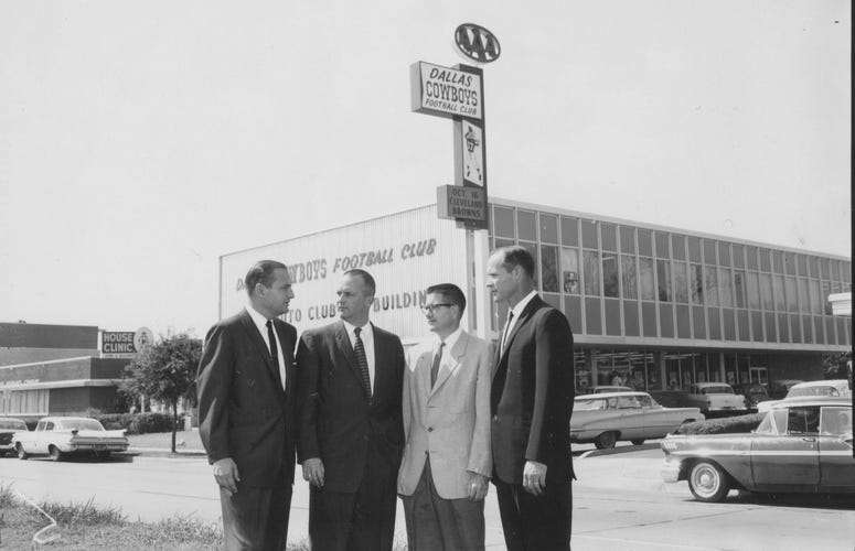 Tex Schramm, Bedford Wynne, Clint W. Murchison, Jr. and Tom Landry), pictured in front of the team's first administrative offices on North Central Expressway.